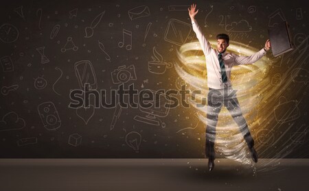 Fericit om de afaceri jumping tornadă maro om Imagine de stoc © ra2studio