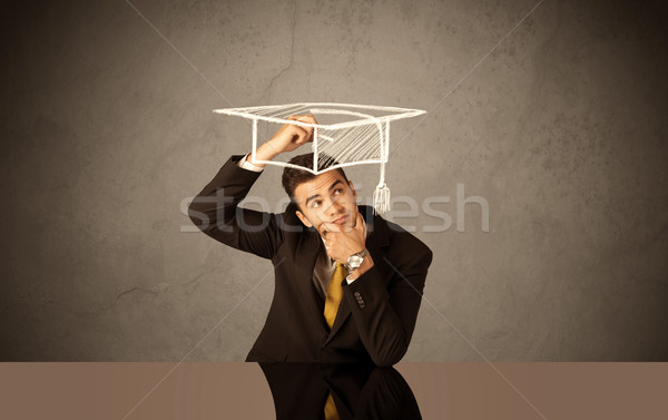 Happy college graduate drawing academic hat Stock photo © ra2studio