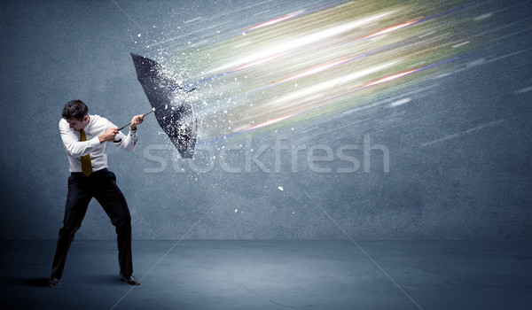 Homme d'affaires lumière parapluie affaires eau mur [[stock_photo]] © ra2studio
