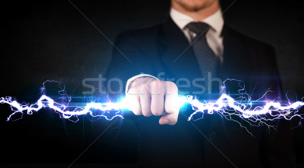 Homme d'affaires électricité lumière mains [[stock_photo]] © ra2studio