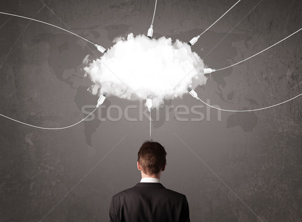 Młody człowiek patrząc Chmura transfer świat usługi Zdjęcia stock © ra2studio