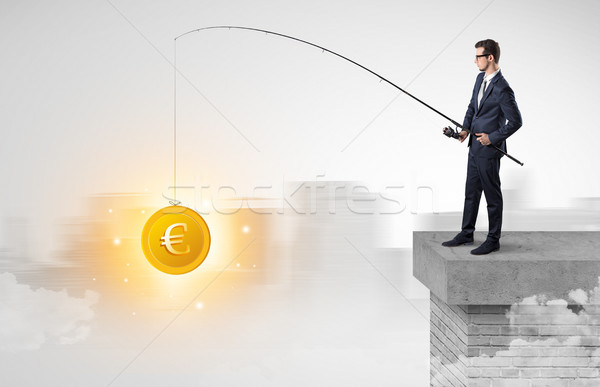 Businessman fishing coins concept Stock photo © ra2studio