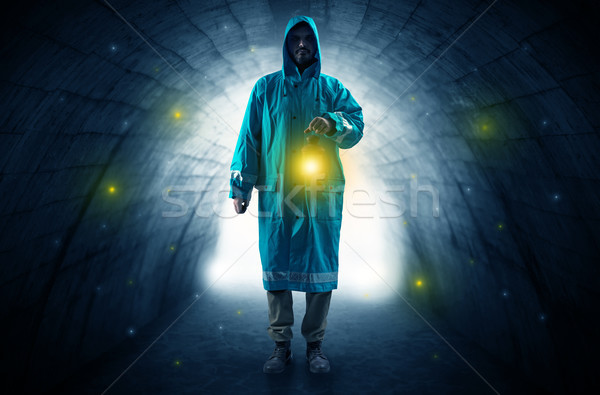 Man walking with lantern in a dark tunnel Stock photo © ra2studio