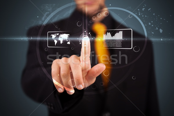 Stock photo: Businessman pressing high tech type of modern buttons