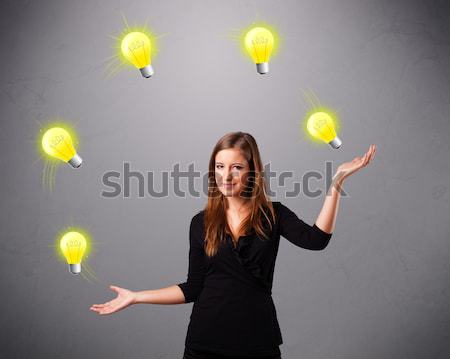 Jeunes dame permanent jonglerie ampoules belle [[stock_photo]] © ra2studio