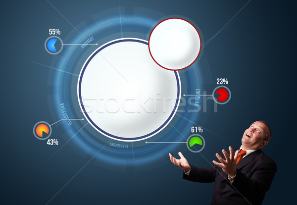 Stock photo: funny businessman in suit presenting abstract modern pie chart
