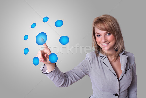 woman pressing digital buttons Stock photo © ra2studio