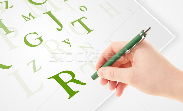 Hand writing various letters on white plain paper Stock photo © ra2studio