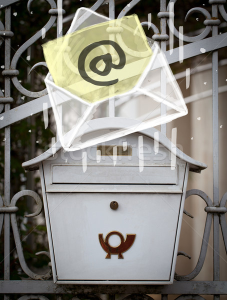 Envelope with email sign dropping into mailbox Stock photo © ra2studio