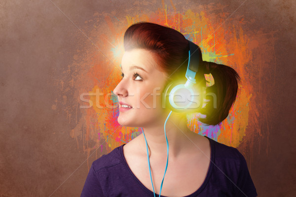 Young woman with headphones listening to music Stock photo © ra2studio