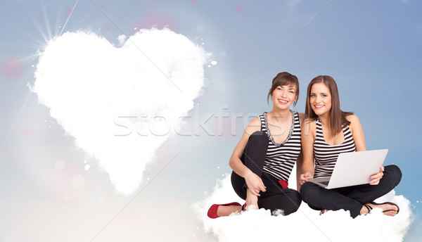 красивой женщины сидят облаке сердце молодые Сток-фото © ra2studio