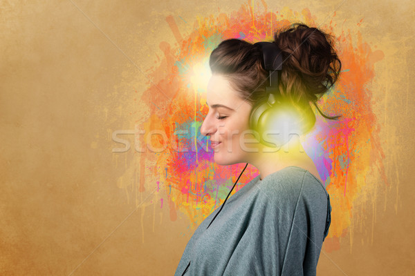 Young woman with headphones listening to music Stock photo © ra2studio