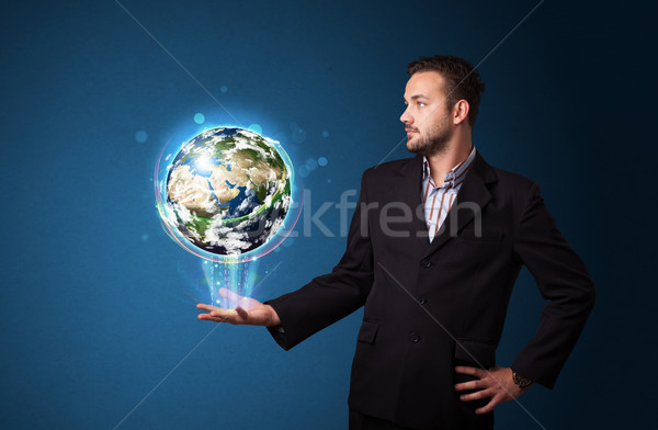 Stockfoto: Zakenman · aarde · wereldbol · jonge