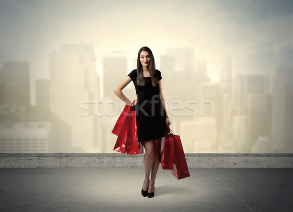 City woman standing with shopping bags Stock photo © ra2studio