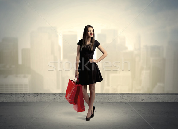 City woman standing with shopping bags Stock photo © ra2studio