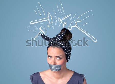 Young woman with glued mouth and hammer marks Stock photo © ra2studio