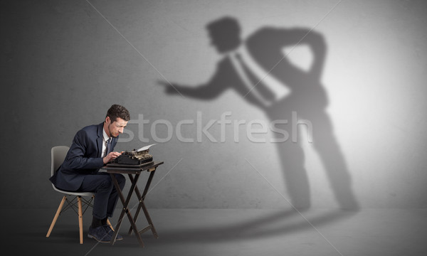 Man working hard and shadow arguing with him Stock photo © ra2studio