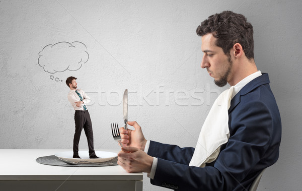 Businessman want to eat small man  Stock photo © ra2studio