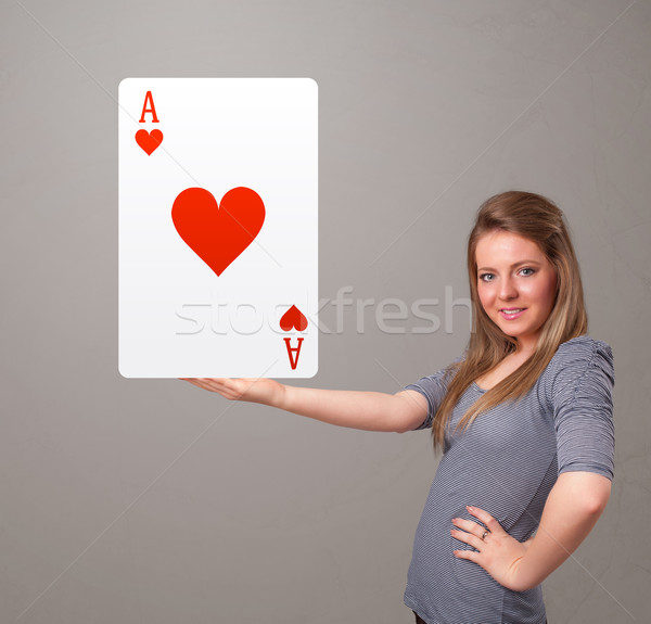 Beautifu woman holding a red heart ace Stock photo © ra2studio