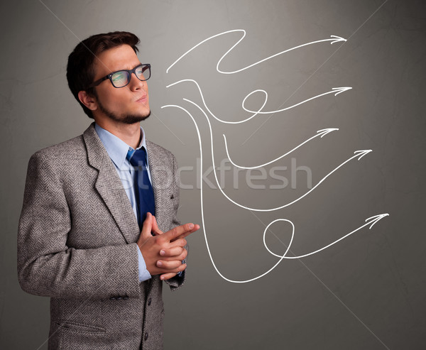 Stock photo: Attractive man looking at multiple curly arrows