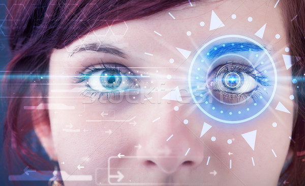 Cyber girl with technolgy eye looking into blue iris Stock photo © ra2studio