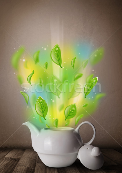 Tea pot with leaves and colorful abstract lights Stock photo © ra2studio