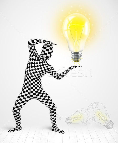 Man in full body with glowing light bulb Stock photo © ra2studio