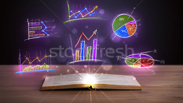 Book on wooden deck with glowing graph illustrations Stock photo © ra2studio
