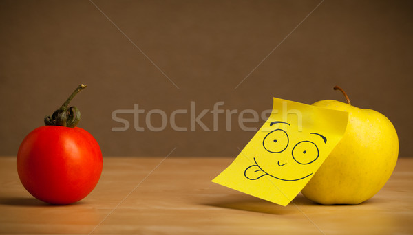 Apple with post-it note sticking out tongue to tomato Stock photo © ra2studio