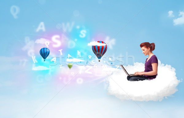 Young woman sitting in cloud with laptop Stock photo © ra2studio