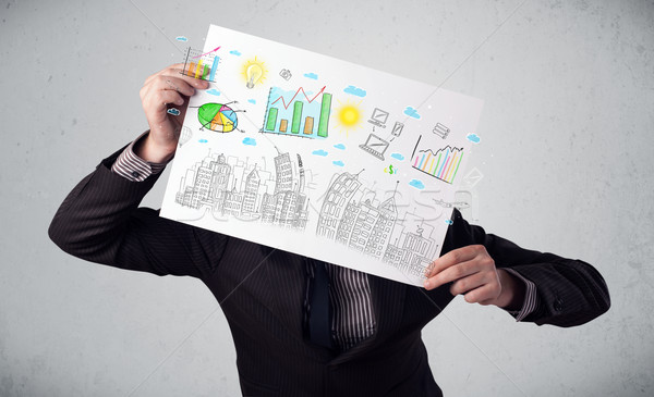 Businessman holding a paper with charts and cityscape in front o Stock photo © ra2studio