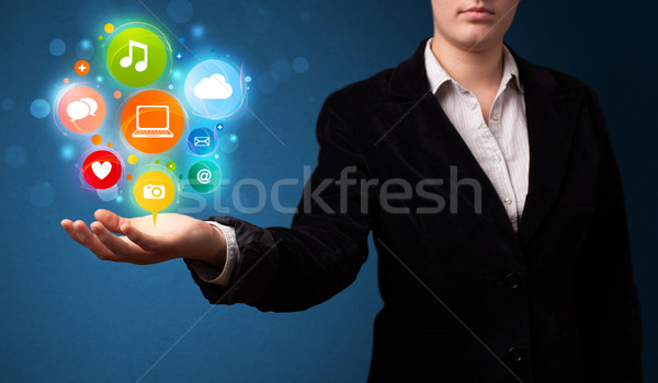 Multimedia icons in the hand of a businesswoman Stock photo © ra2studio
