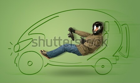 Man drives an eco friendy electric hand drawn car  Stock photo © ra2studio