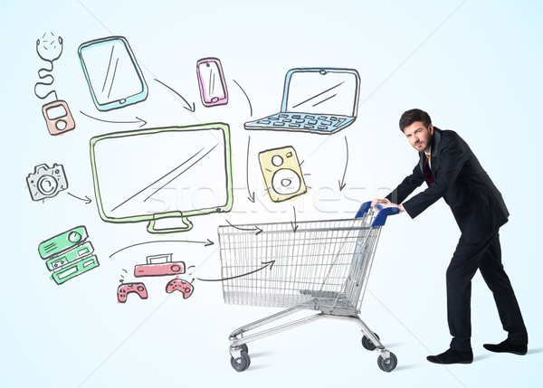 Businessman with shopping cart Stock photo © ra2studio