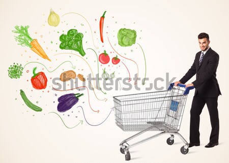 Stock photo: Businessman with shopping cart with vegetables