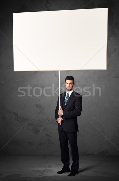 Businessman with blank whiteboard Stock photo © ra2studio