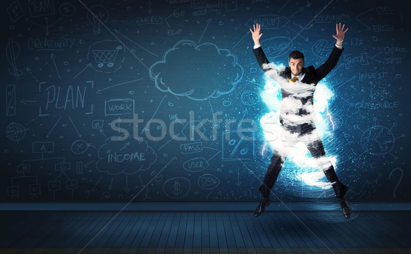 Happy business man jumping with storm cloud around him  Stock photo © ra2studio