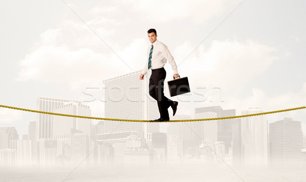 Homme d'affaires équilibrage or corde jeunes élégante Photo stock © ra2studio