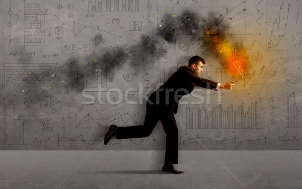 Stock photo: Running business man with fire laptop