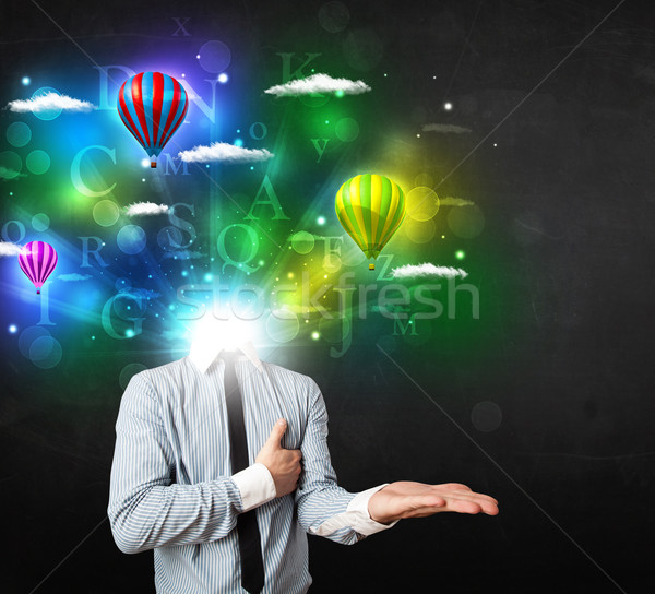 Man in suit with dreamy cloudscape concept Stock photo © ra2studio