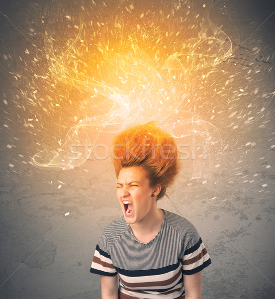 Young woman with energetic exploding red hair  Stock photo © ra2studio