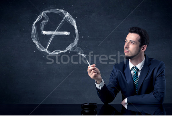 Biznesmen palenia papierosów dymu podpisania Zdjęcia stock © ra2studio