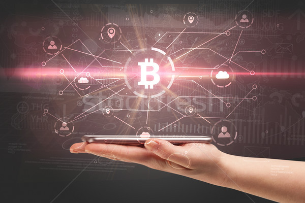 Hand using phone with bitcoin link network and online concept Stock photo © ra2studio