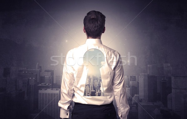 Empresário em pé buraco de fechadura de volta jovem pensando Foto stock © ra2studio