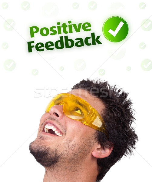 Young head looking at positive negative signs Stock photo © ra2studio