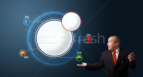 crazy businessman in suit holding a phone and presenting abstract modern pie chart Stock photo © ra2studio
