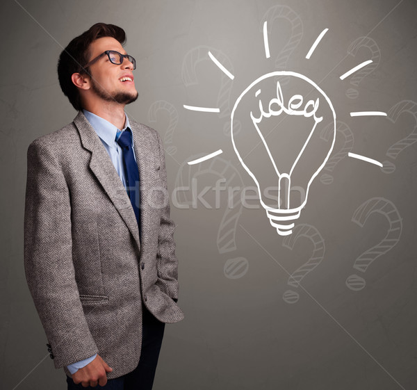 Young boy comming up with a light bulb idea sign Stock photo © ra2studio