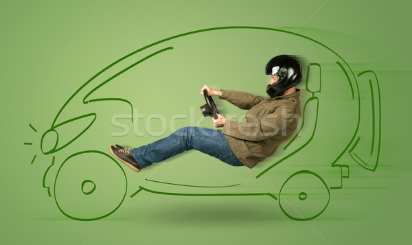 Man drives an eco friendy electric hand drawn car  Stock photo © ra2studio