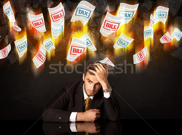 Depresso imprenditore seduta brucia fiscali bill Foto d'archivio © ra2studio