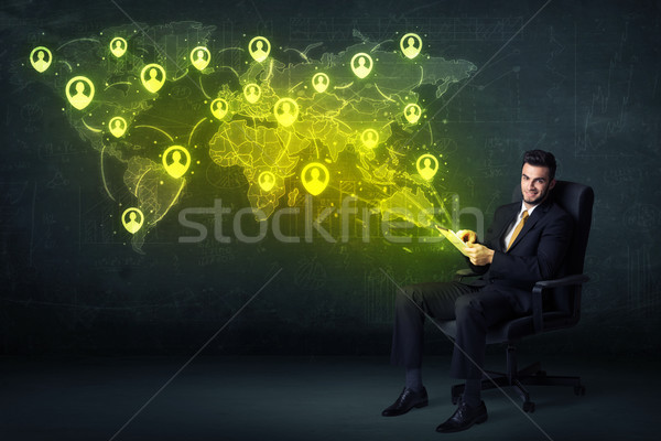Businessman in office with tablet and social network world map Stock photo © ra2studio